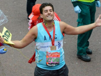 James Argent from TOWIE smiles and closes his eyes as he crosses the Virgin London Marathon finish line